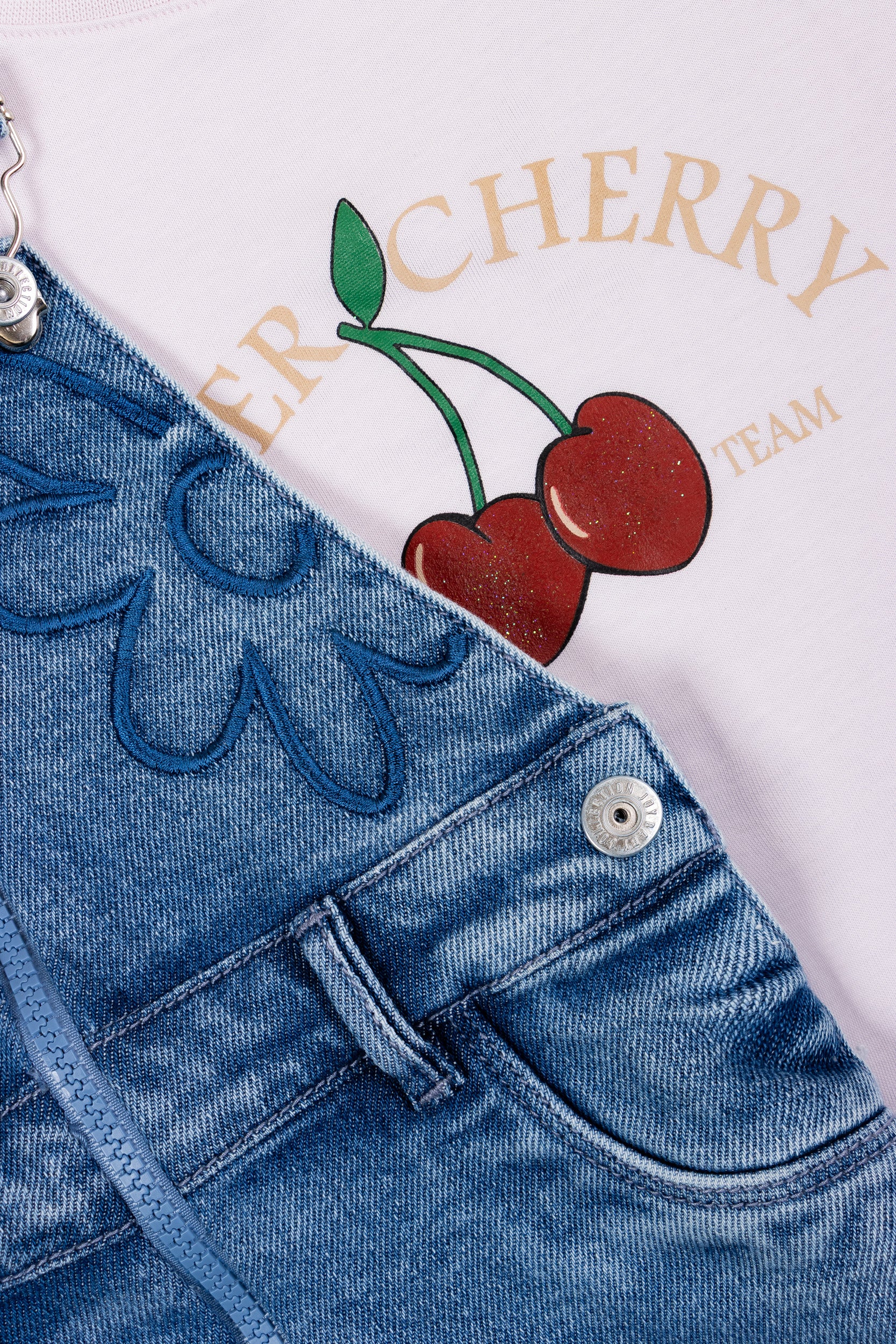 CONJUNTO OVEROL FALDA CHERRY NIÑA LILA