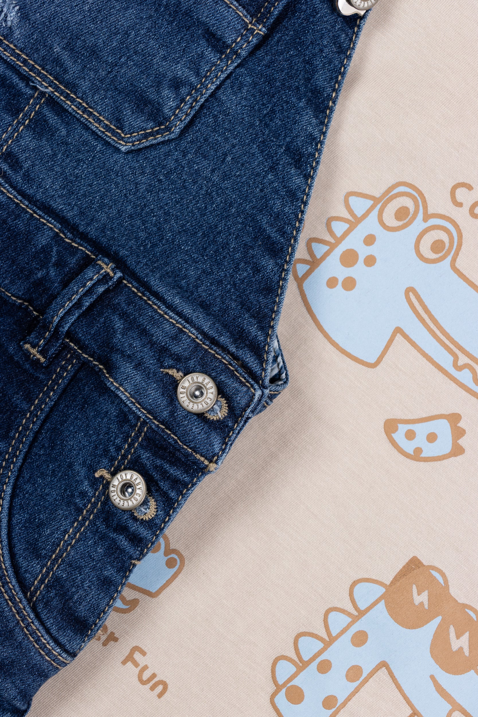 OVEROL DENIM CORTO DINOSAURIOS NIÑO BEIGE